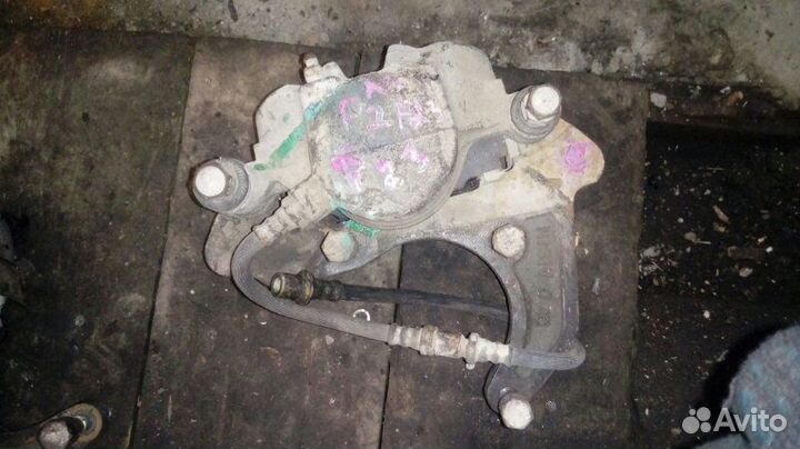 Тормозной суппорт передний левый Nissan Atlas