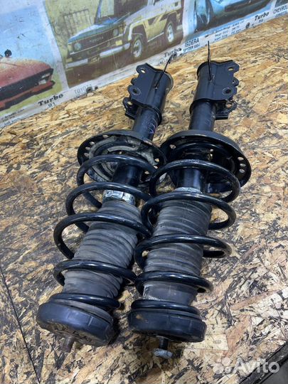 Стойки амортизаторы передние Опель Астра J