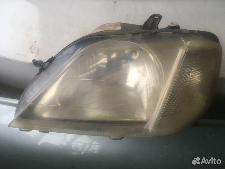 Фара левая Renault LoganI