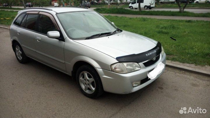 Крыло mazda familia