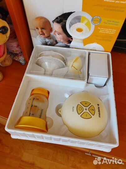 Молокоотсос Medela swing flex