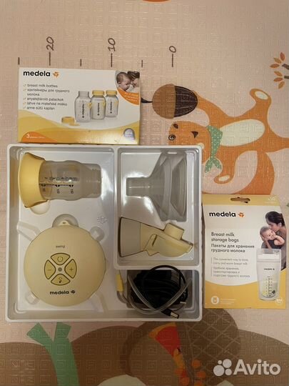 Молокоотсос medela swing