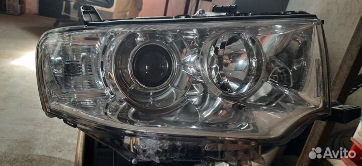 Фара левая mitsubishi Pajero Sport 09) / L200 05-1