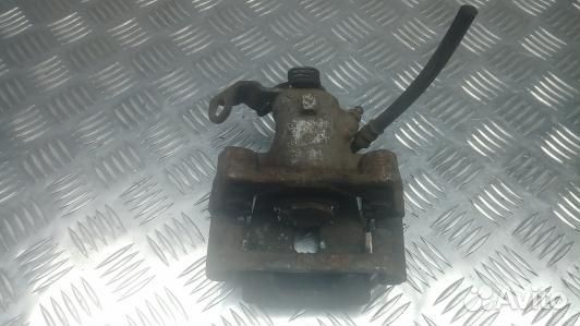 Суппорт тормозной задний левый opel astra H (1OK23LS02)