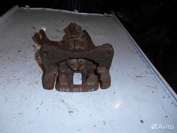 Суппорт задний правый Nissan Primera P10