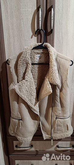 Жилетка меховая женская