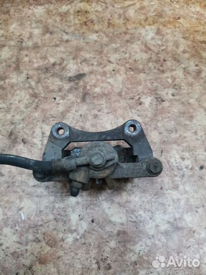 Суппорт тормозной задний левый Chevrolet Lacetti