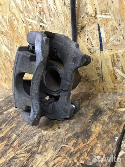 Суппорт тормозной передний левый Skoda Fabia 2