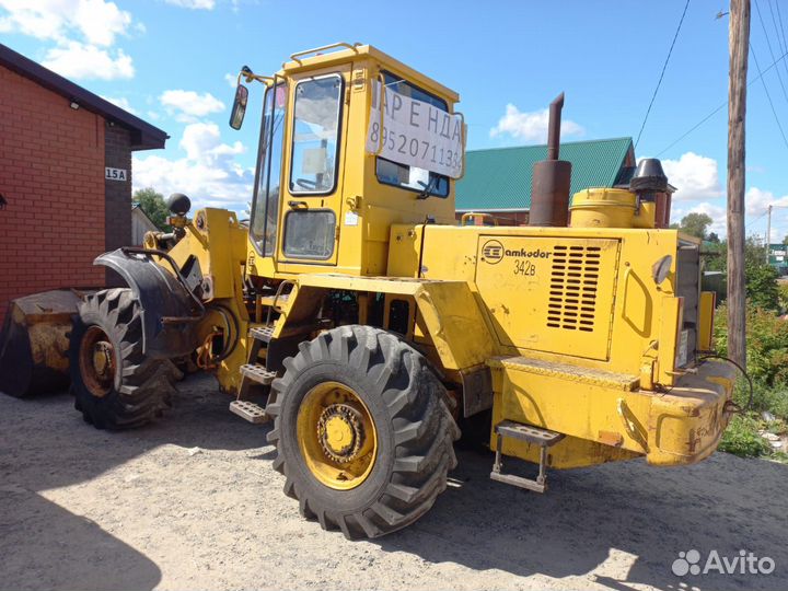 Аренда фронтального погрузчика услуги трактора