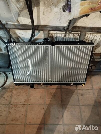Новый радиатор митсубиси лансер 9
