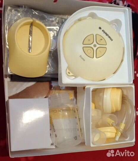 Молокоотсос medela электрический