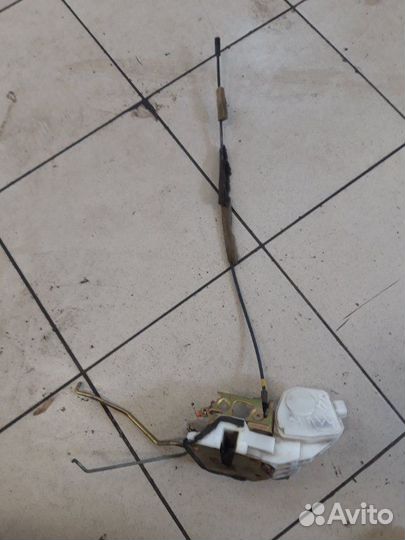 Замок дверной передний левый Mitsubishi Lancer 9