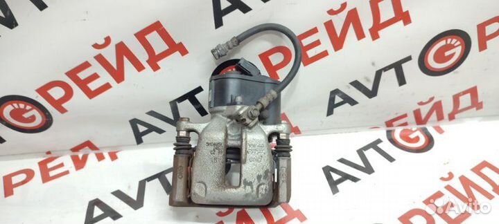 Суппорт тормозной задний левый Volkswagen Tiguan