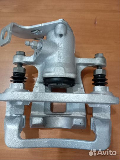 Суппорт тормозной задний kia rio 3,Солярис