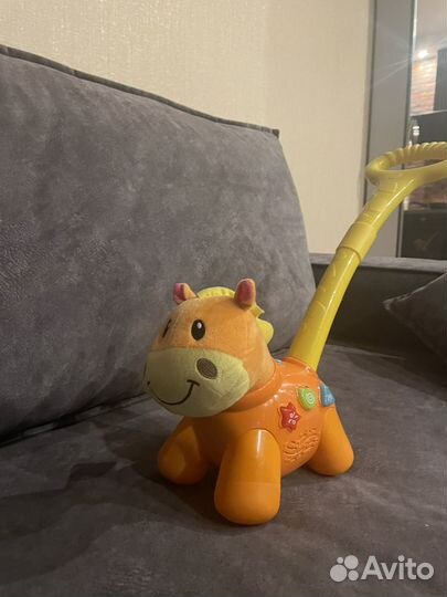 Музыкальная каталка лошадка