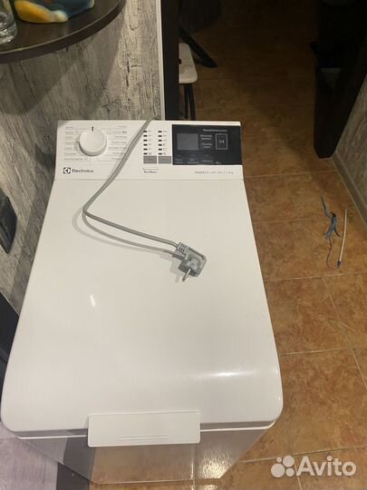 Стиральная машинка с вертикальной загрузкой