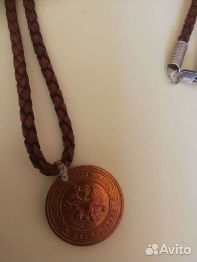 Монета медная 1912 года на кож. шнурке