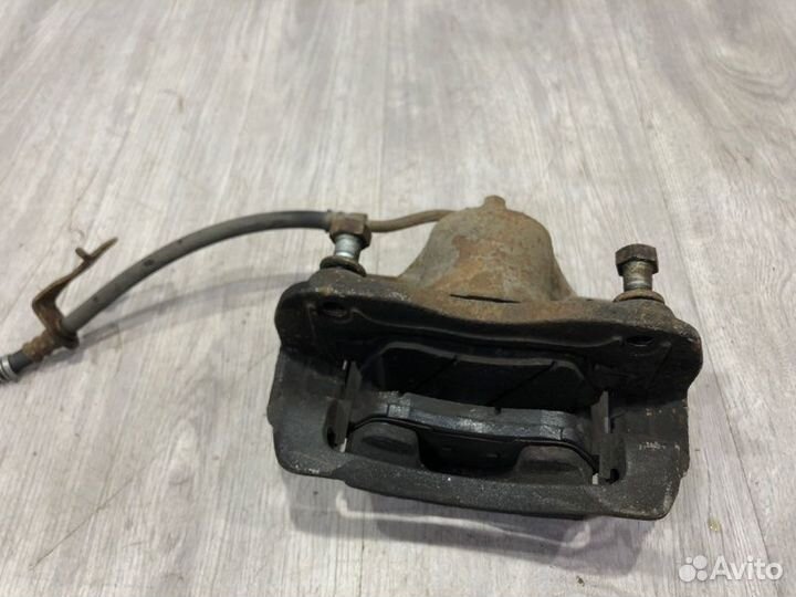 Суппорт тормозной передний левый Kia Rio 3 G4FA