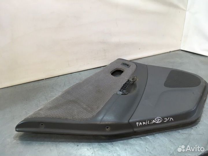 Обшивка двери задняя левая Mazda Familia седан BJ