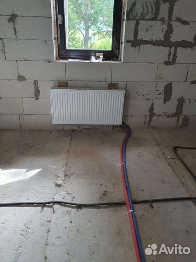 Монтаж системы отопления с тёплым полом в коттедже