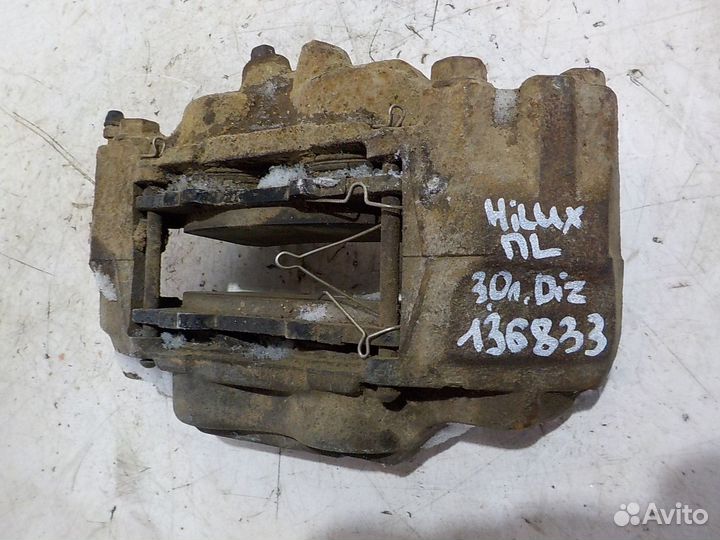 Суппорт передний левый Toyota Hilux