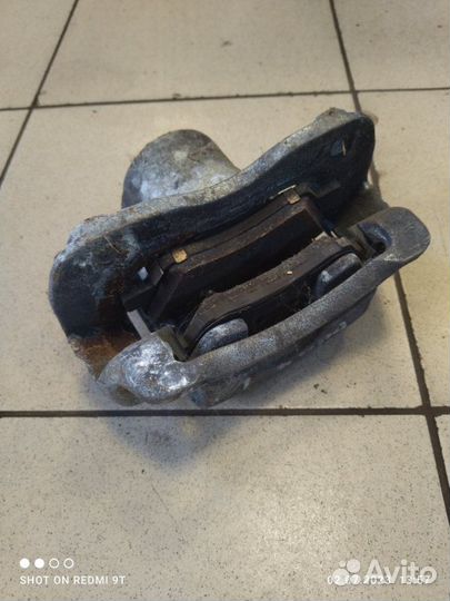 Суппорт тормозной передний левый Kia Rio 4