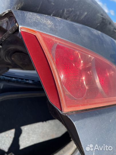 Mitsubishi lancer 10 фонарь в крышку багажника