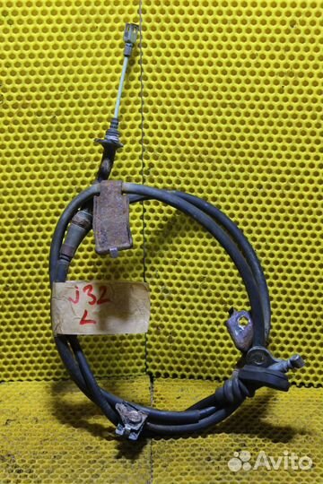 Трос ручного тормоза левый Nissan Teana J32