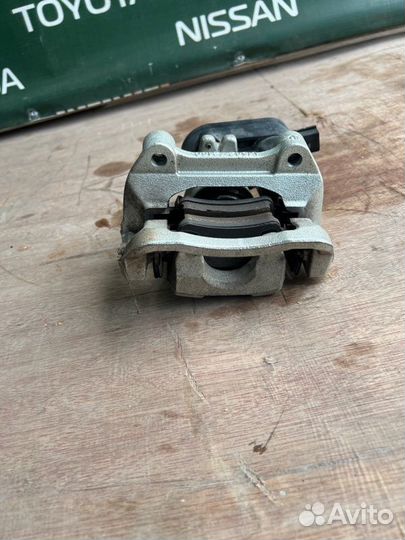 Суппорт тормозной задний левый Kia Sportage 5 G4KN