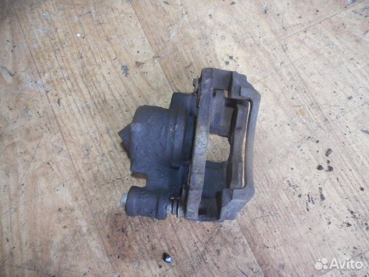 Суппорт передний левый Ford Escort/Orion 1995-2001