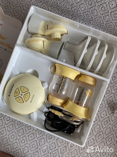 Молокоотсос medela swing maxi flex