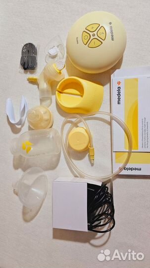 Молокоотсос medela электрический