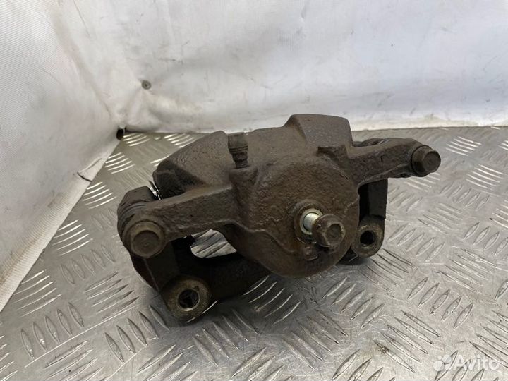 Суппорт тормозной передний правый Nissan X-Trail