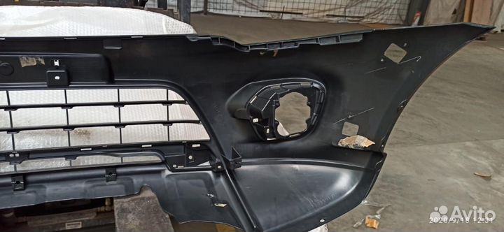 Бампер передний Mitsubishi L200 6400G111