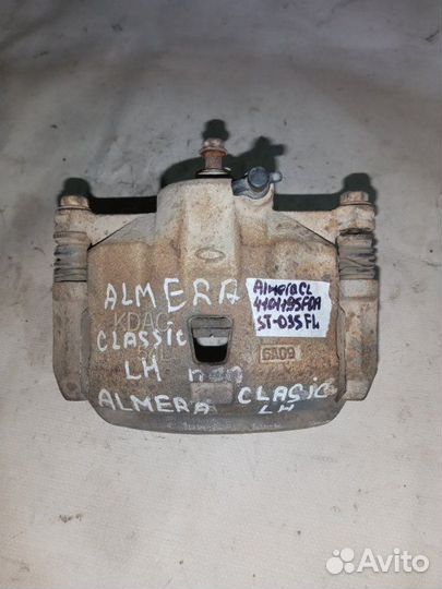 Суппорт тормозной передний левый Nissan Almera