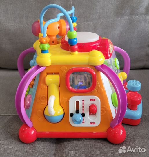 Развивающие игрушки: утка и бизиборд