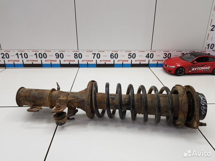 Амортизатор передний левый с пружиной (Kia Rio)