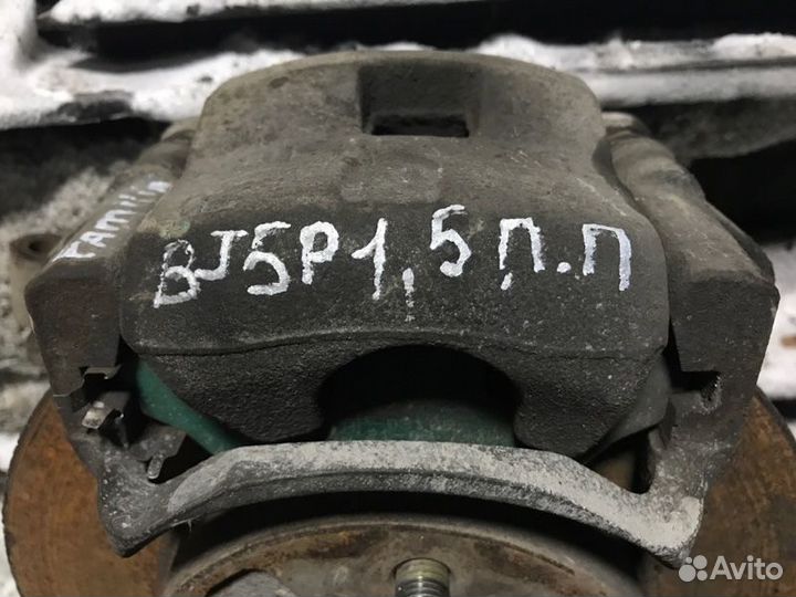 Суппорт тормозной передний правый Mazda Familia