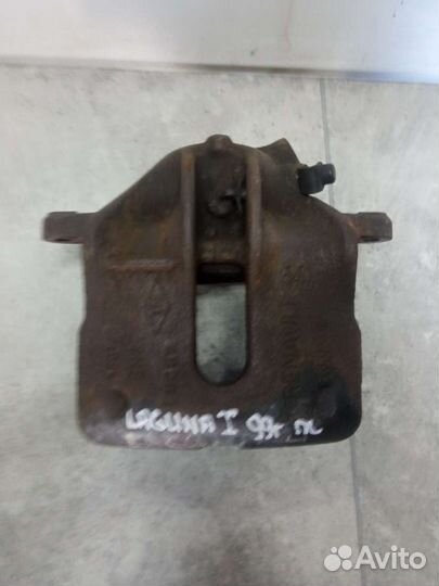 Суппорт тормозной передний левый Renault Laguna 1