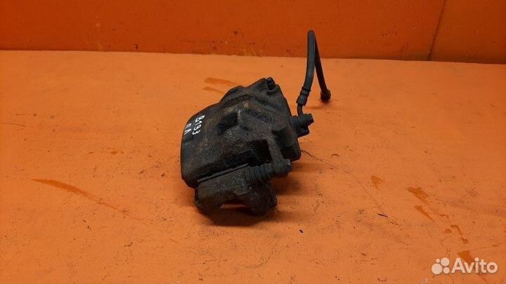 Суппорт тормозной передний левый Nissan Pathfinder