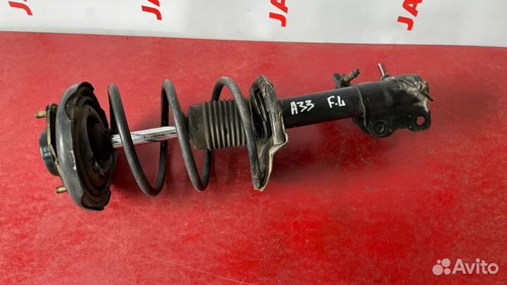 Стойка подвески передняя левая Nissan Cefiro A33