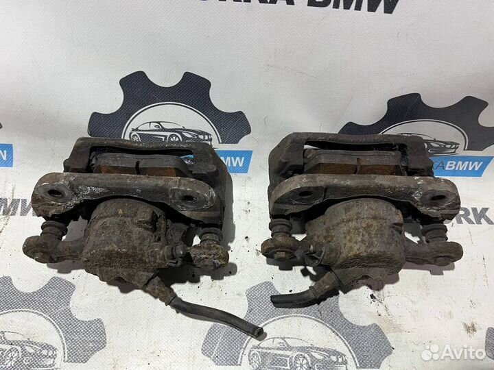 Суппорт тормозной передний левый правый BMW 1-сери