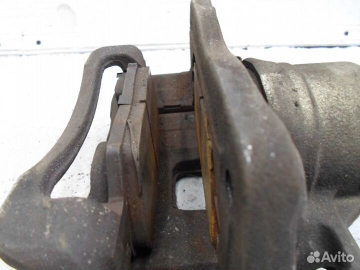 Суппорт передний левый Kia Sorento 2 XM