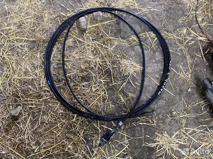 Трос лючка бензобака Mazda 3 BK седан