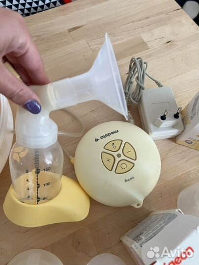 Молокоотсос medela электрический