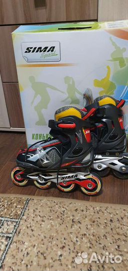 Роликовые коньки