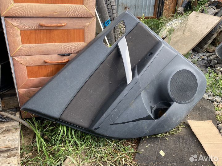 Обшивка двери задней левой mazda 3 BL седан