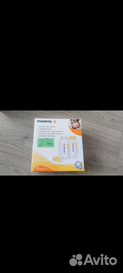 Молокоотсос medela ручной + 2 бутылочки