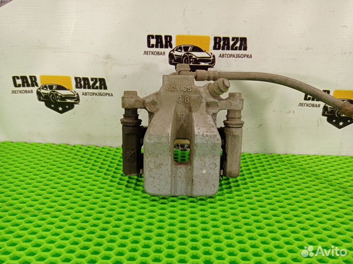 Суппорт тормозной задний правый R Toyota Camry