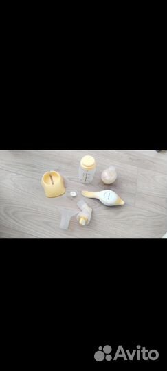 Молокоотсос medela ручной + 2 бутылочки